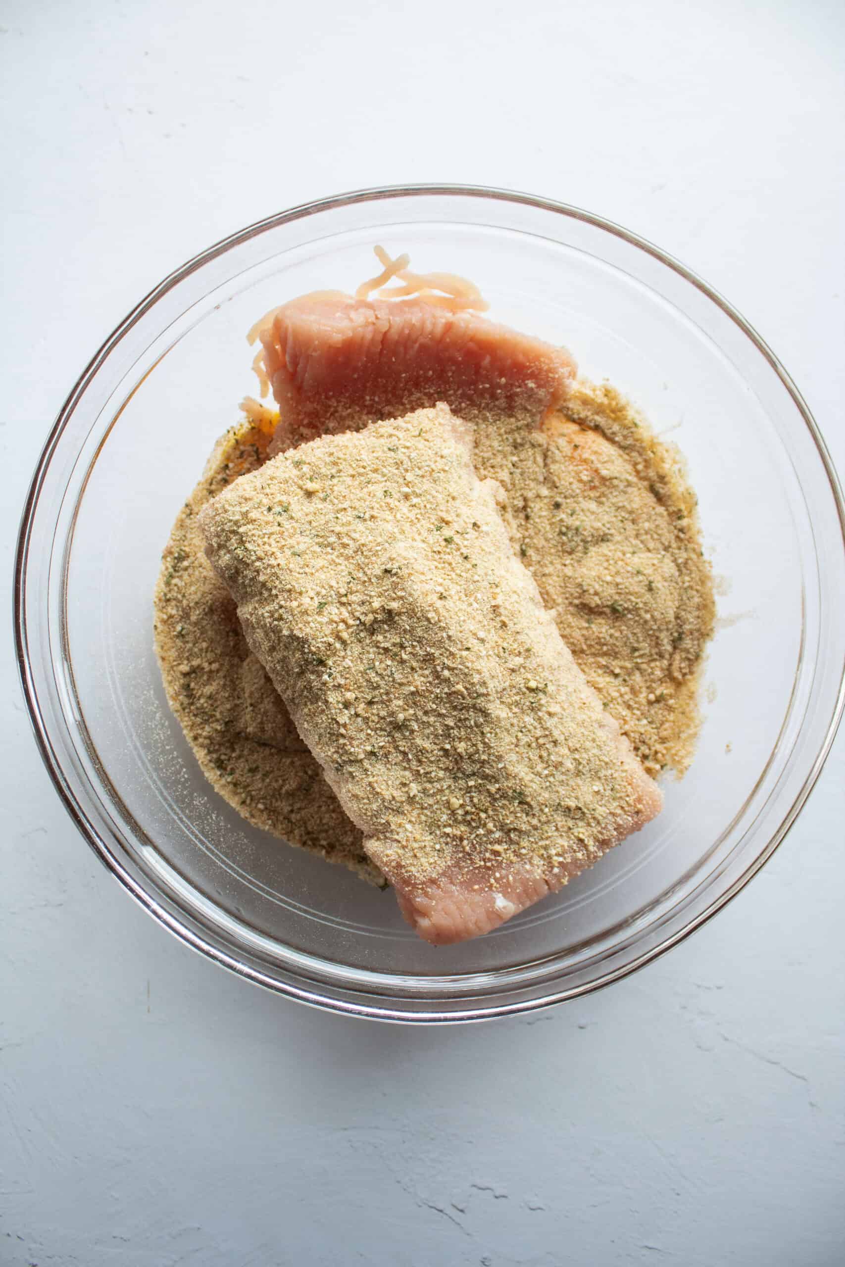 Ground chicken, breadcrumbs, eggs, salt, pepper, and garlic powder in a large mixing bowl.