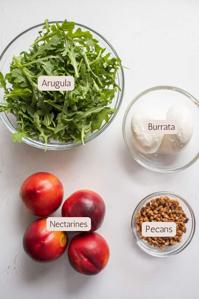 Ingredients to make a nectarine and burrata salad.