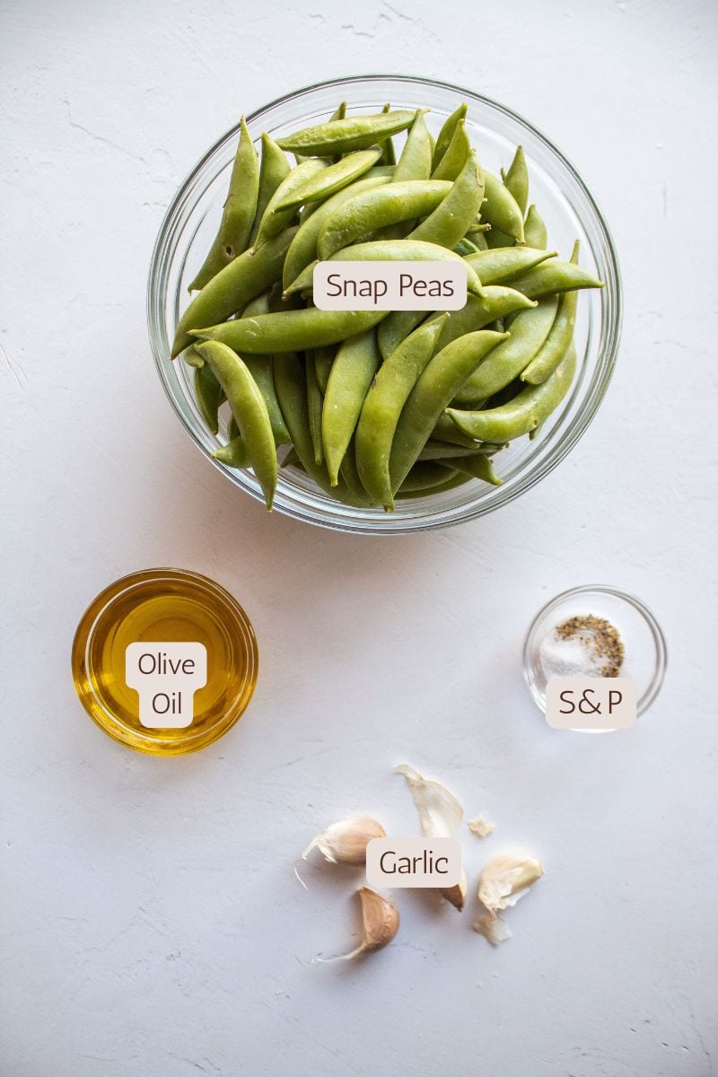 Ingredients to make sautéed sugar snap peas with garlic.