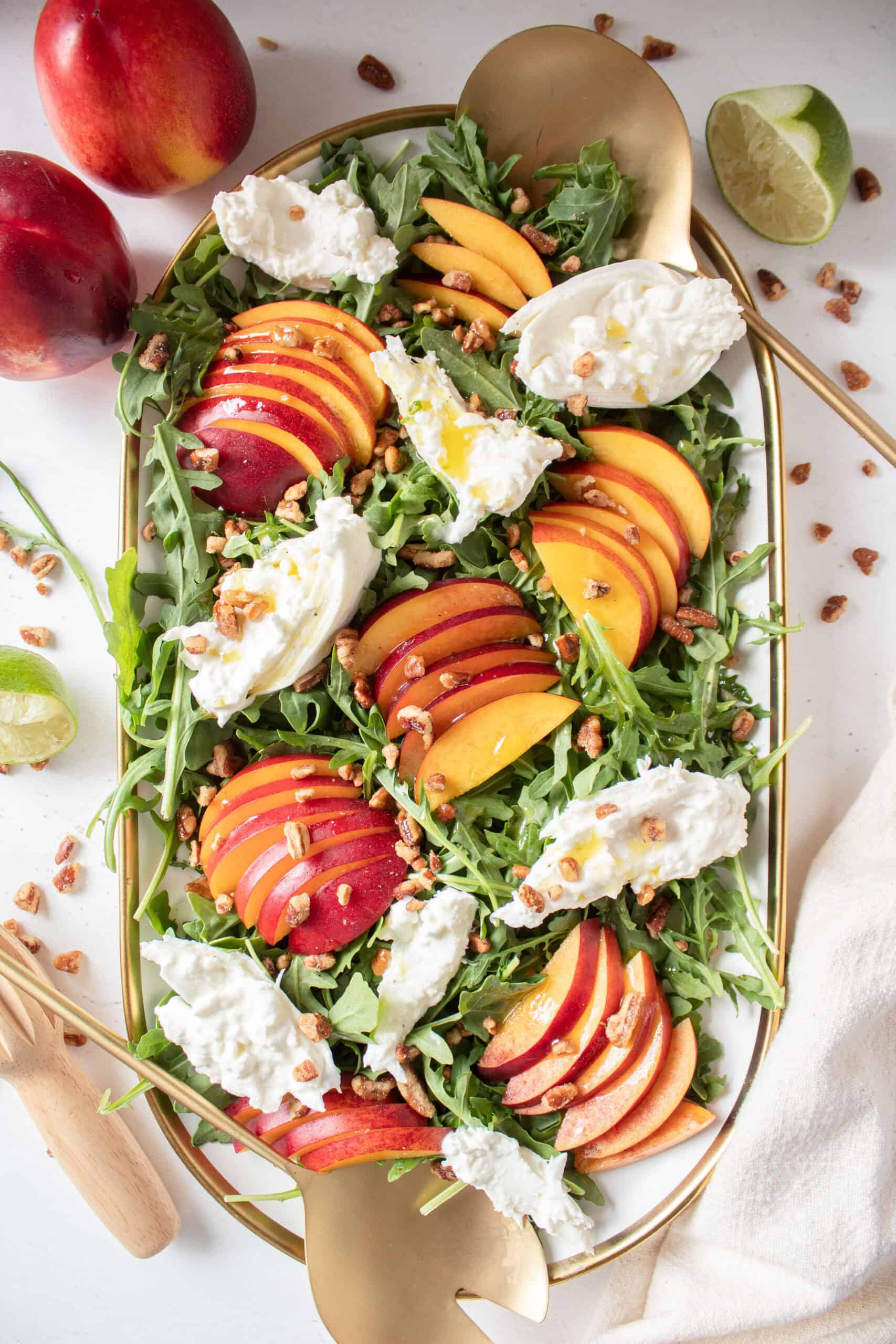 nectarine and burrata salad on a platter.