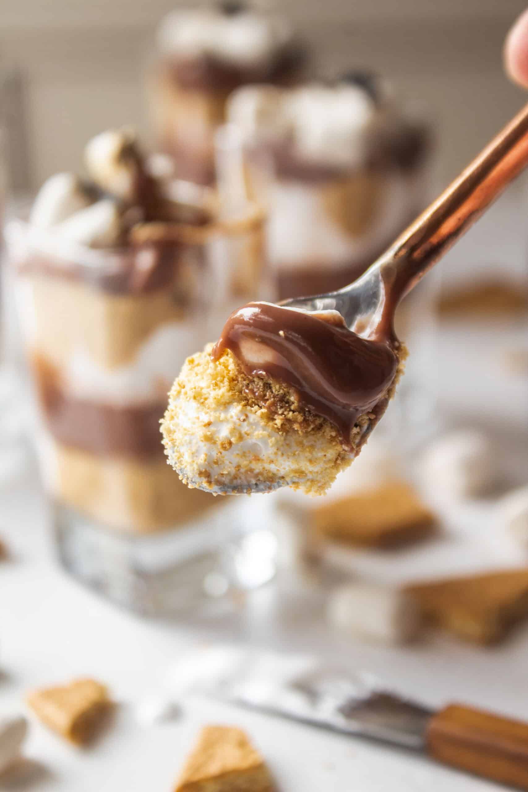 A scoop of smores parfait on a spoon.