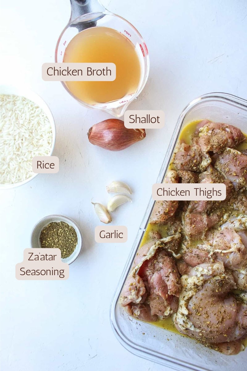 Ingredients needed to make one skillet chicken thighs and rice.