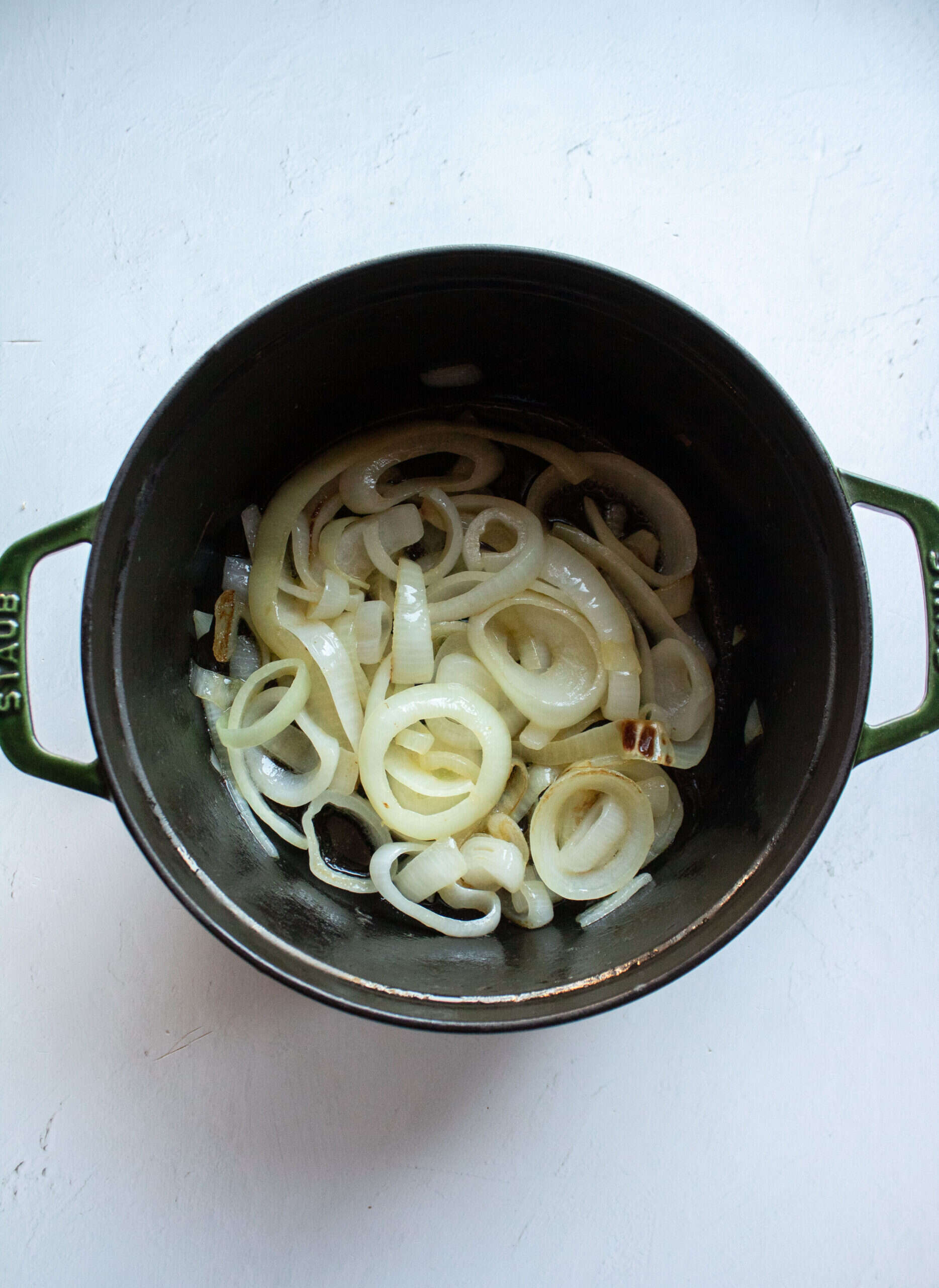 Onions and butter in a dutch oven.