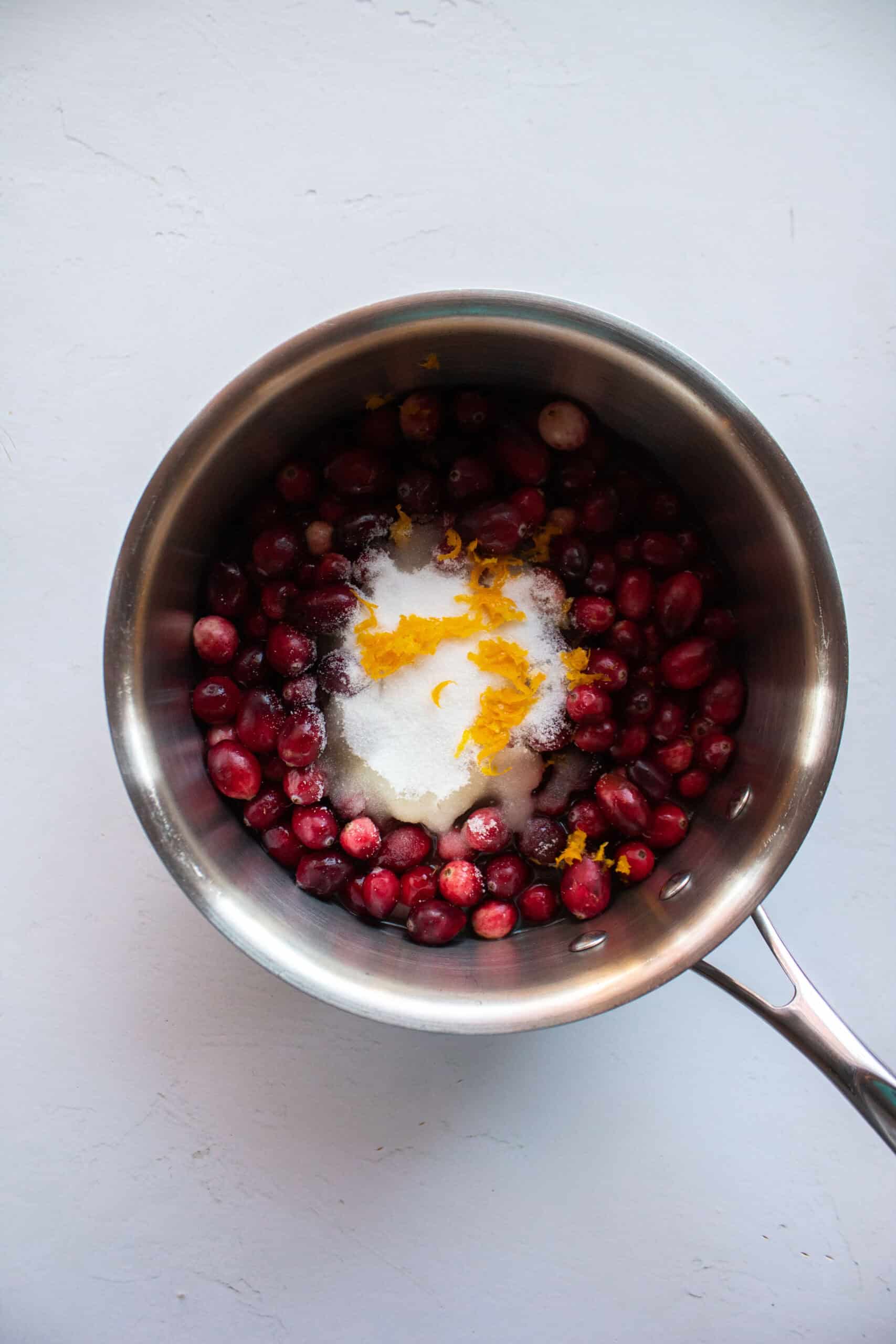 
Whole cranberries, granulated sugar, orange juice, orange zest, and pineapple juice in a medium saucepan.