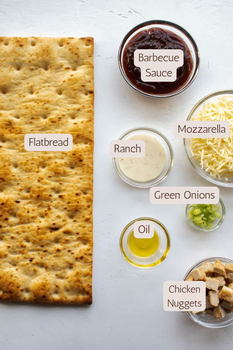 Ingredients to make a barbecue chicken flatbread pizza.