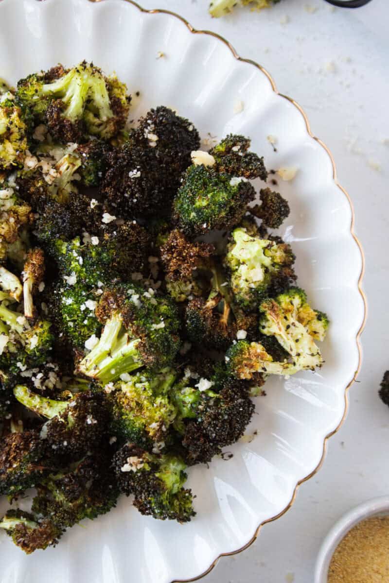Crispy air fryer broccoli with parmesan on a plate.