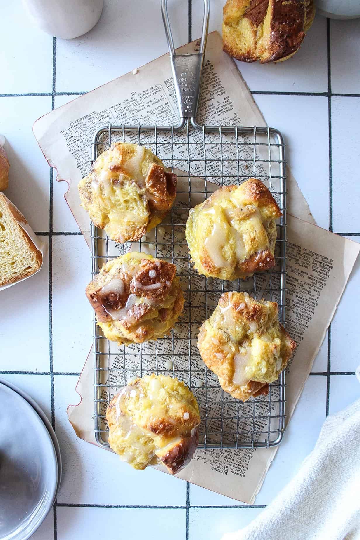 Five bite size french toast muffins on a cooling rack.