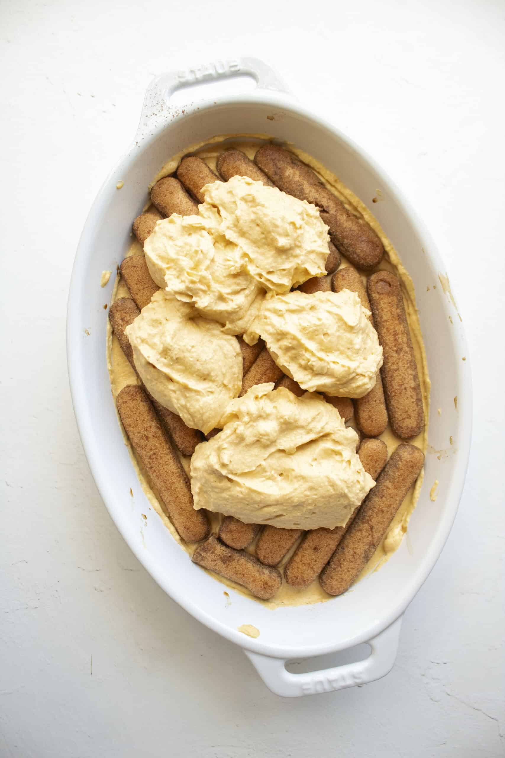 Layers of espresso soaked ladyfingers and pumpkin mascarpone cream to make a pumpkin tiramisu.