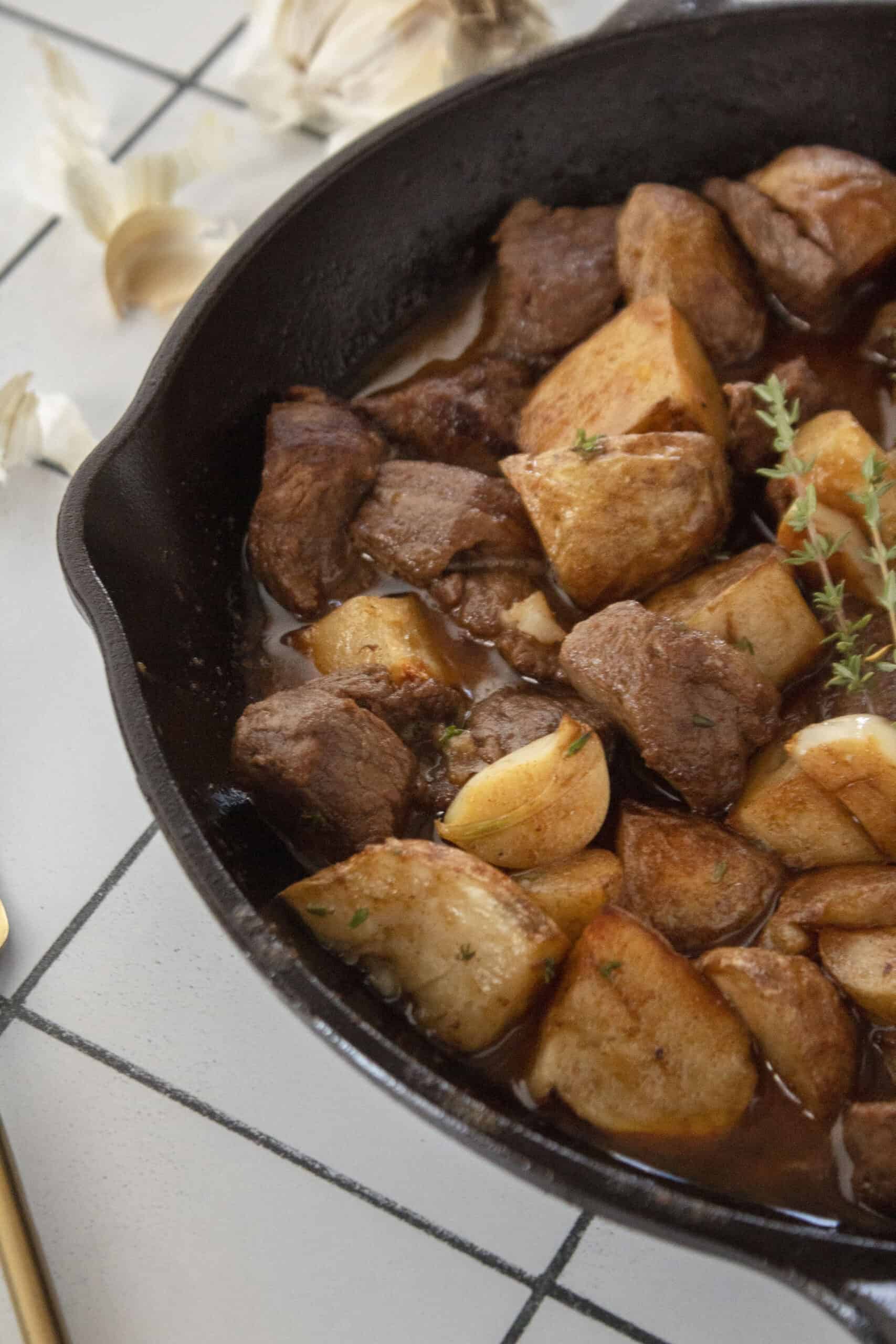 Cast iron garlic butter steak tips with air fried potatoes.
