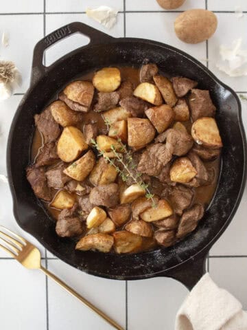 Cast iron garlic butter steak tips with air fried potatoes.