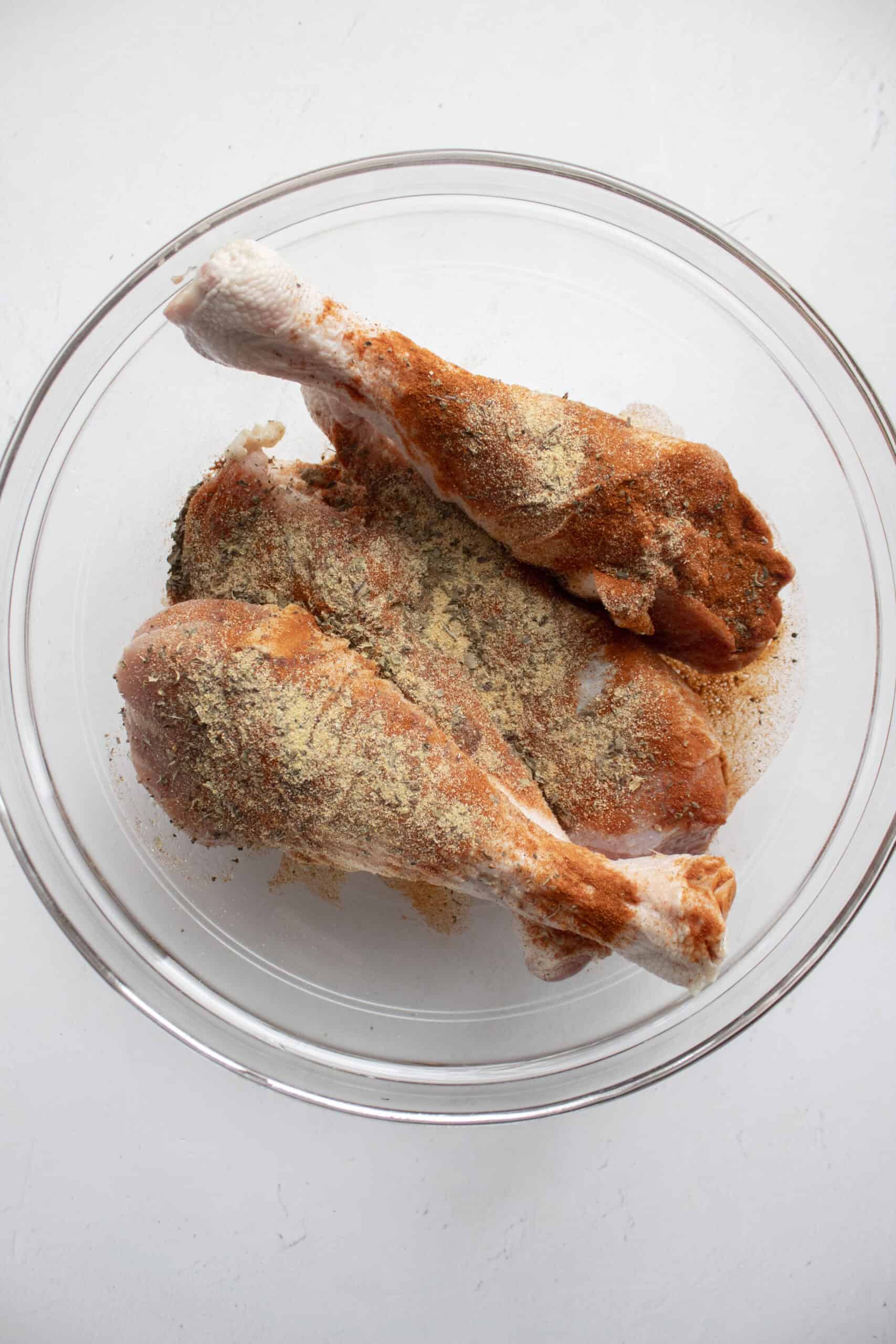 Four turkey legs pat dried then tossed in olive oil with paprika, garlic powder, salt, pepper, and Worcestershire sauce.