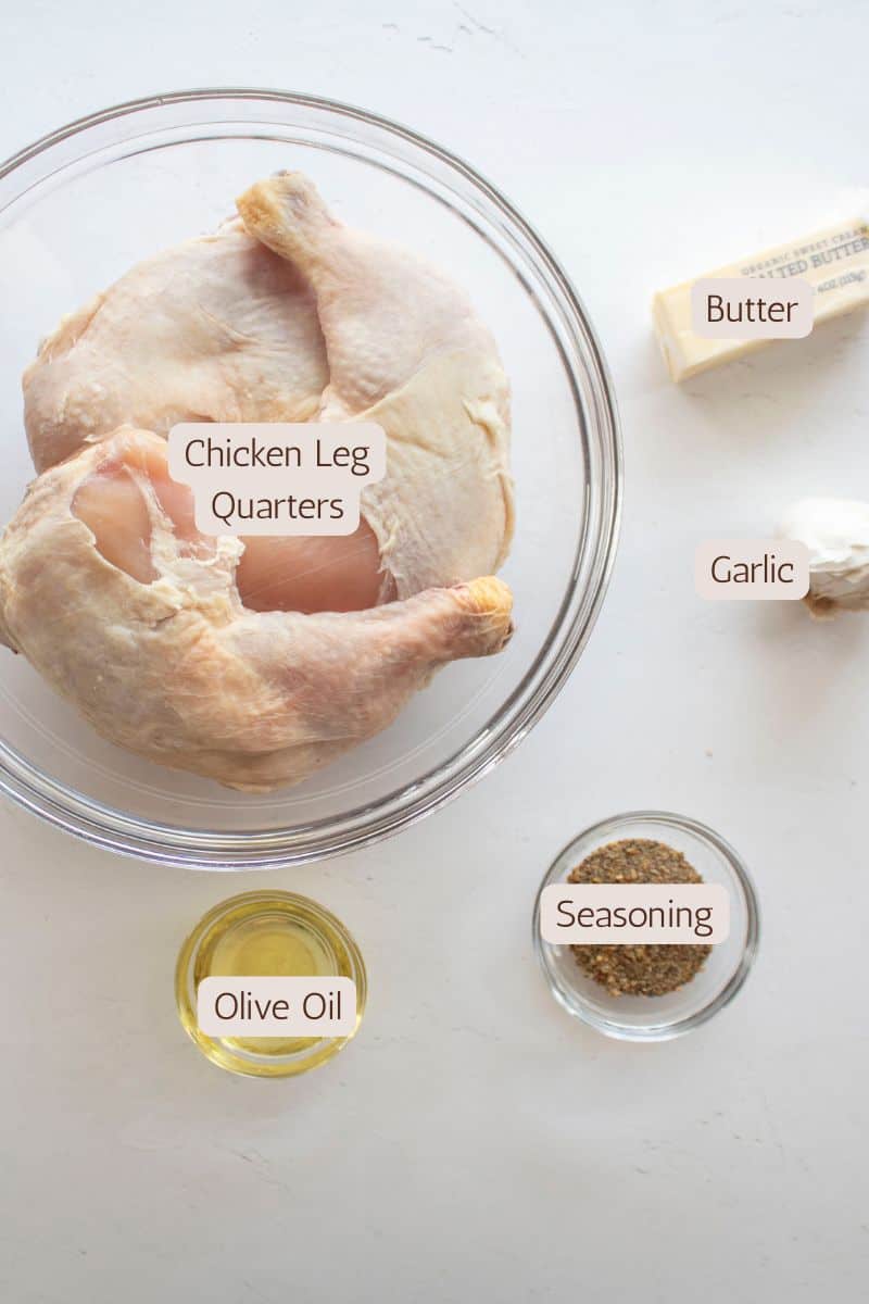 Ingredients to make lemon pepper chicken leg quarters topped with garlic butter.